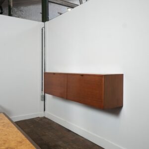 Floating teak sideboard by Florence Knoll